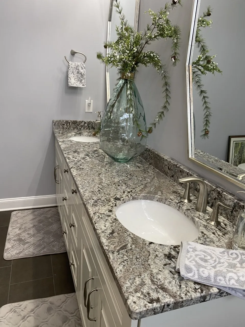 Granite vanity, dark cabinetry
