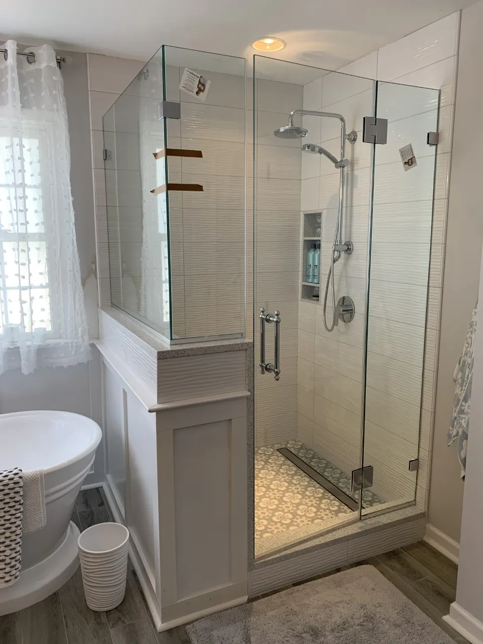Tiled shower with niche installed by Ana Stone